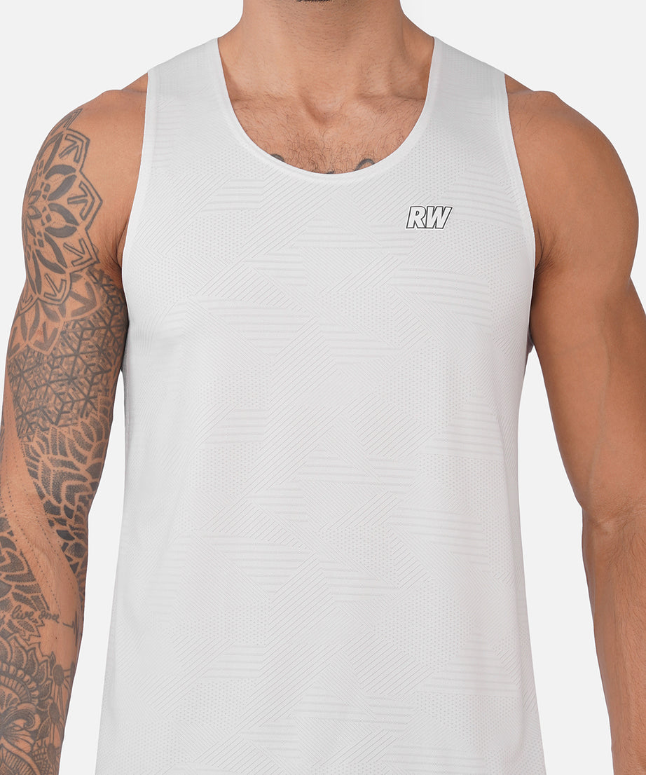 A close-up of a man wearing a white sleeveless athletic tank top with a small 'RW' logo on the chest, set against a plain light gray background.