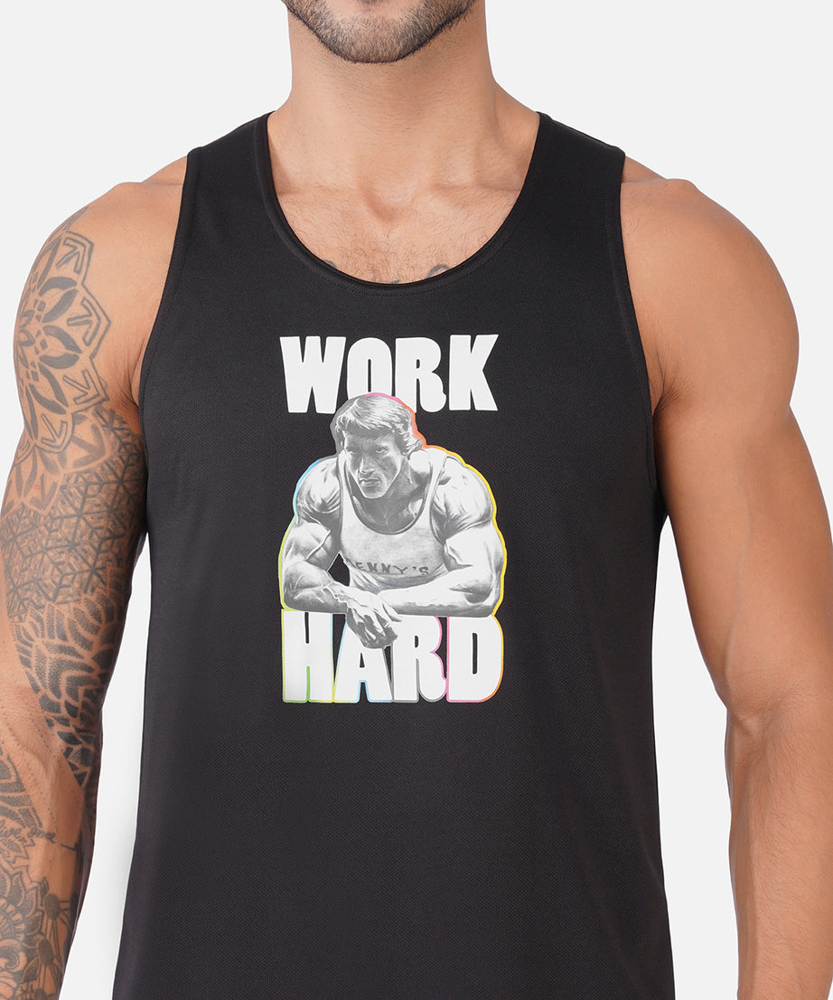 A man wearing a black tank top with a graphic print that reads 'WORK HARD' in white letters around an illustration of a muscular man lifting weights.